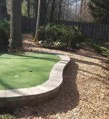 Constructed with interlocking base panels and surfaced using tour quality putting and fringe turf, these greens are designed by industry experts for serious golfers. Backyard Putting Greens In Md Dc Va Backyard Putting Green Installers