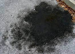 Oil can leave a dark stain on pavement, but you may be able to clean even stubborn spots out of your driveway. Remove Oil Stains From Concrete Or Asphalt Driveways In 3 Simple Steps Doorways Magazine