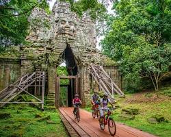Mountain biker on a dirt trail in the Cambodian countryside.