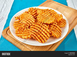 These waffles have the crisp crust and fluffy interior of traditional waffles, but the sweet potatoes provide a deeper, more complex flavor. Crispy Potato Waffles Image Photo Free Trial Bigstock
