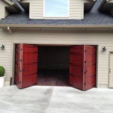 Welcome Back The Carriage Door That Is Insulated Sound Deadening Lightweight And Stronger Than Steel Pound Garage Doors Garage Door Styles Garage Door Design