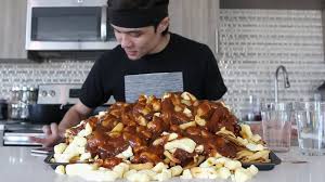 Poutine, a canadian dish made of french fries topped with cheese curds and gravy. Giant Poutine Challenge Saltiest Challenge Ever Youtube