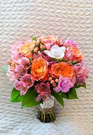 Dreamy, romantic and lovely, the bridal bouquet featuring blush ranunculus, tulips, roses, peonies or other beautiful flowers in season would suit perfectly a spring or summer bride. Bridal Bouquet Of Bi Color Peach Coral Free Spirit Roses Freesia Hypericum Berries And Alstroemer Bridal Bouquet Wedding Flowers Wedding Flower Inspiration