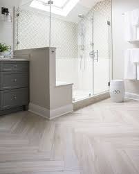 Wood plank porcelain tile shower with full width bench, 2 fabricated corner caddies, and flat rock pan. Porcelain Wood Look Tile Porcelain Wood Look Tiles Bring Warmth And Character To This Spaciou Bathroom Interior Design Master Bathroom Design Bathrooms Remodel