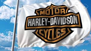 Global harley davidson flag importers and buyers. Waving Flag With Harley Davidson Logo Against Sky And Clouds Stock Photo Picture And Royalty Free Image Image 80800257