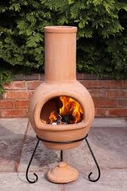 This wood burning fire pit conveniently features an opening that provides easy access to the fire to keep it going during outdoor gatherings. A Natural Terracotta Clay Chimenea Made In Mexico This Patio Heater Is A Large Size And Will Allow You To Sit Around The Outdoor Fire Pit Fire Pit Diy Fire Pit