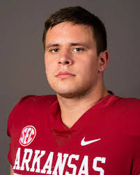 Quincey McAdoo helping Razorbacks