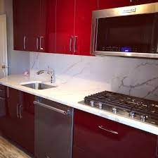 Red Kitchen Cabinetry With Marble Look Quartz Kitchen Cabinetry Kitchen Room Design Kitchen Design