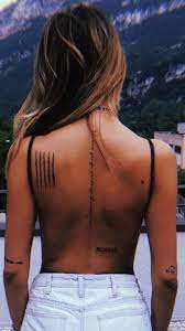 Tattoo designs on spine looks super cool. The Spinal Cord Is Seen As The Core Of Our Being Why Not Get A Tattoo That Makes The Most Of This Esthetic And Meaningf Charm Tattoo Tattoos Back Tattoo Women
