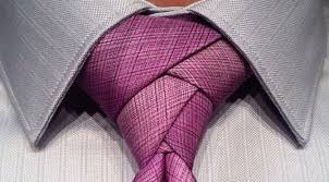 Cross the wide part of the tie over the narrow end, and start to bring it up through the hole between collar and tie. How To Make Your Necktie Look So Cool Learn From The Experts