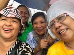Members of the Catholic community and others participate in a candlelight  procession through a section of Hagåtña celebrating the observance of Santa  Marian Kamalen