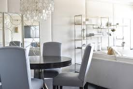 Gray Upholstered Chairs At Round Black Dining Table Transitional Dining Room