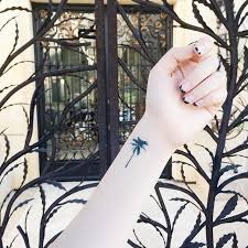 For example, adding birds perched on a palm tree branch may mean you have. 50 Beautiful Tree Tattoo Ideas For Women Mybodiart