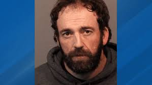 Man arrested after hitting victim with car near Mogul