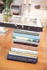 Coffee table books can be quite expensive and impersonal, so creating your own allows you to choose imagery you love whilst saving a few pennies. 30 Totally Unique Ways To Decorate Your Home With Books Decorate With Books Cheap Coffee Table Diy Coffee Table