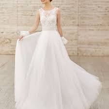Ornate lace and floral applique is layered atop illusion mesh and tulle to form this modern heirloom wedding dress. 35 Illusion Wedding Dresses For Daring Brides