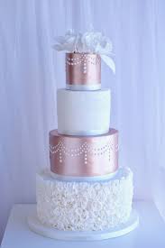 Elegant 4 Tier Rose Gold Wedding Cake With Ruffles And Sugar Flowers Weddingcakeideas Weddingcakeins Rose Gold Wedding Cakes Gold Wedding Cake Rose Gold Cake