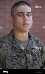 U.S. Marine Corps Recruit Luis Medina with Kilo Company, 3rd Recruit  Training Battalion, arrives at Marine Corps Recruit Depot San Diego, Feb.  22, 2022. After the recruits are checked for prohibited items,