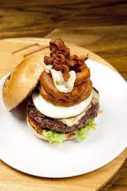 The Works Burger Made With 100 Grass Fed Beef Patty Sunny Side Up Egg Cheese Onion Rings Bacon Thehandburger Thesoupsp Burger Beef Patty Grass Fed Beef
