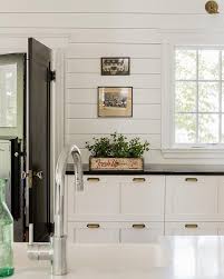 Black And White Cottage Kitchen Features A White Shaker Cabinets Adorned With Brass Vintage Pulls P White Cottage Kitchens Shiplap Kitchen
