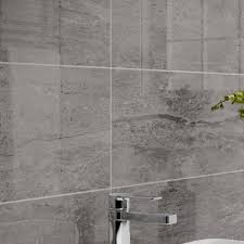 Tiled bathroom with wood furniture. Montserrat Dark Grey Tile 250 X 500mm Per Box Wall Tile