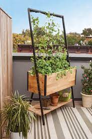 Self Watering Pots To Keep Plants Hydrated While You Re Away Sunset Planter Trellis Planter Box With Trellis Diy Trellis