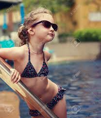 This fashion template allows designers to show in one illustration both the front and the back view of the design. Little Female Model Posing In Fashion Kids Sunglasses And Swimsuit Near Swimming Pool Closeup Portrait Stock Photo Picture And Royalty Free Image Image 44575664