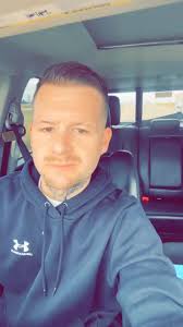 Shaboozey Theows Hockey Jersey Out to Fams