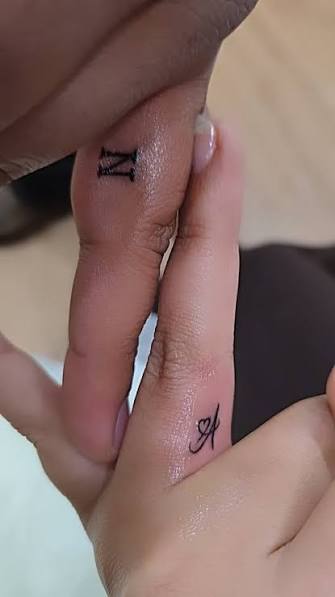 Initial Tattoos On Ring Finger