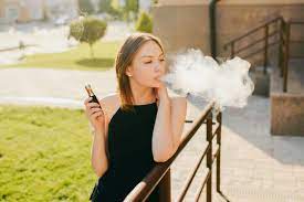 .enterprises smoking lovely · bone thugs n harmony for smokers only ℗ 2011 thugline. Lovely Trendy Girl Smoking Vaping E Cigarette During Walking On The Urban Street Outdoors Stock Photo Adobe Stock