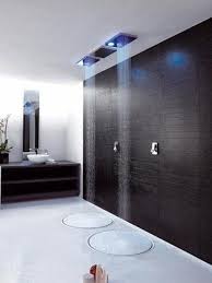 A pure luxury shower and bathroom design with a lounge seat that fills with water right next to the ceiling installed rain fall shower head 21. 30 Luxury Shower Designs Demonstrating Latest Trends In Modern Bathrooms