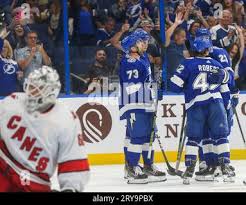 The Tampa Bay Lightning celebrate a goal by Felix Robert (42) against  Carolina Hurricanes goaltender Yaniv Perets (60) during the second period  of an NHL hockey preseason game Friday, Sept. 29. 2023, in Tampa, Fla.  (Dirk Shadd/Tampa Bay Times via ...