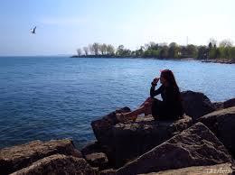It curls the shore from ashbridges park to kew beach with a boardwalk running alongside. Woodbine Beach Explorer On Rocks Silhouette The Coast Of Misery
