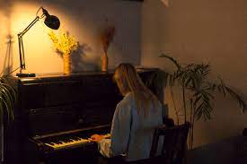 Pianoforall is one of the most popular online piano courses online and has helped over Girl Playing Piano At Home By Demetr White