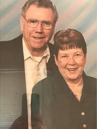 Voodoo rose blooms in orange color around town