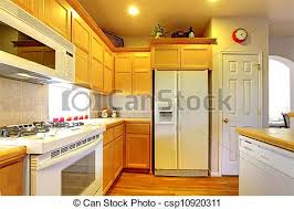 kitchen with yellow wood cabinets and