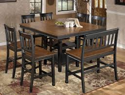 For storage, get a counter height dining room set with a rectangular centerpiece that has shelving, cubbies, or a wine rack. Counter Height Dining Table For 8 Off 60