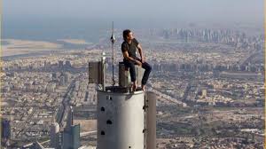 bʊrd͡ʒ xaˈliːfa, 'khalifa tower'), known as the burj dubai prior to its inauguration in 2010, is a skyscraper in dubai, united arab emirates.with a total height of 829.8 m (2,722 ft, just over half a mile) and a roof height (excluding antenna, but including a 244 m spire) of 828. Did Tom Cruise Sit Atop The Burj Khalifa Without A Harness Snopes Com