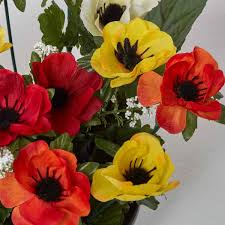 A fabulous anemone with deep red petals and a purple heart. Orange And Red Anemone Artificial Flower Arrangement In Grave Vase