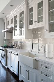 White Kitchen Cabinets Glass Doors Dark Wood Floors Backsplash White Mini Subway Tile Kitchen Design Farmhouse Kitchen Cabinets Kitchen Cabinets Makeover