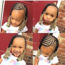 Reverse braided strands scattered all over the head accessorized with beads Matchy Hair Braid Models To Be Applied On Twin Sisters Braids Hairstyles For Black Kids