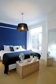 Take inspiration from this living room, featuring white walls and blue vintage sofas upholstered in a ralph lauren home stripe. Desire To Inspire Desiretoinspire Net White Bedroom Decor Dark Blue Bedroom Walls Blue Bedroom Decor