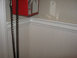 The casual look of beadboard makes it. We Used Beadboard Wallpaper Below The Existing Chair Rail And Just Added More Trim Then Painted Chair Rail Molding Chair Rail Contemporary Living Room Chairs
