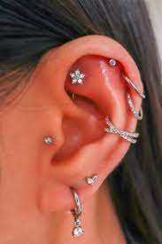 Unique Multiple Helix Conch Ear Piercing Ideas Flower Earring Studs Hoop Rings Www Impuria In 2021 Belly Piercing Jewelry Ear Piercings Rook Nose Piercing Jewelry