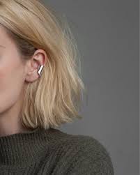 Muted Tones And Silver Details The Uneven Ear Cuff Are Now Back In Stock Ear Cuff Earrings Ear Cuff Piercing