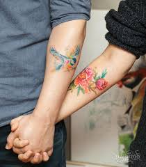 Forearm Bird And Rose Tattoo Couple Watercolor Bird And Flowers Tattoo Couples Tattoo Designs Tattoos Watercolor Tattoo Flower