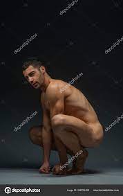 Naked male posing