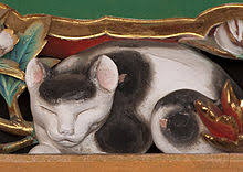 Its red bow has faded to pink and its short tail shows that it is a japanese bobtail. Nemuri Neko Wikipedia