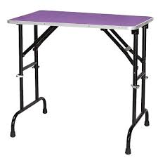 A dog grooming table raises the level of your furry friend so you can reach him easily for bathing, trimming, drying or grooming. Master Equipment Adjustable Height Folding Pet Grooming Table With Nonslip Pebbled Vinyl Surface And Locking Legs Purple Target