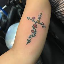 Cross with flowers inside tattoo. 18 Small Cross Tattoo On Bicep
